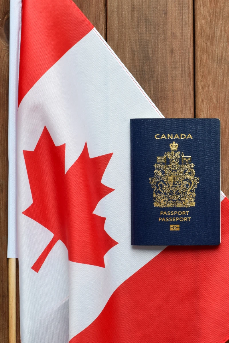 Canadian passport with maple leaf flag